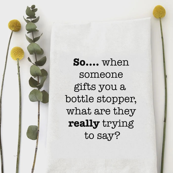 White cotton bottle stopper tea towel with black printed text so for kitchen use