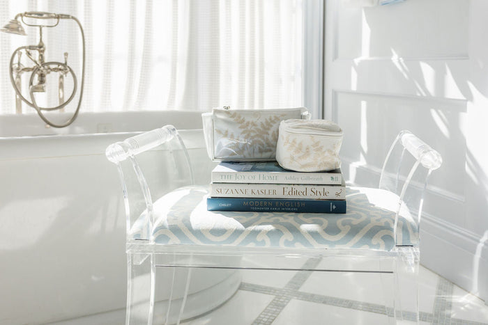 Fern travel cases arranged on a patterned chair by Lenora