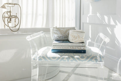 Fern travel cases arranged on a patterned chair by Lenora