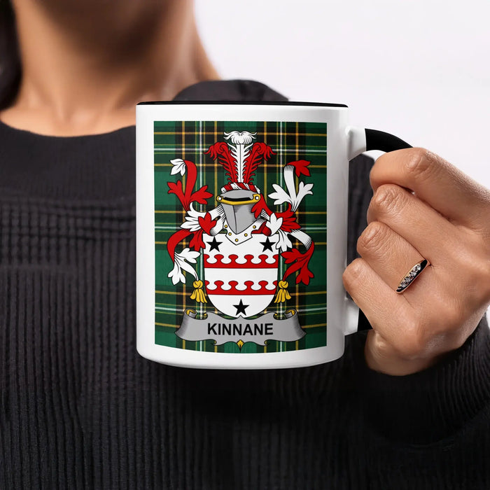 Mug featuring the KINNANE coat of arms on a tartan background.
