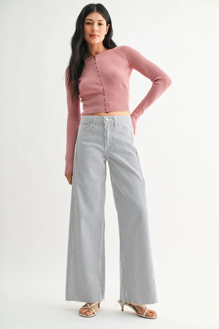 Pink ribbed long-sleeve cropped cardigan paired with mid rise stripe wide leg denim jeans in classic blue denim