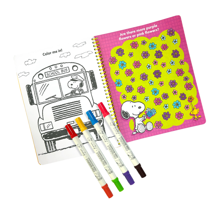 Opened activity book with coloring page and 4 markers from the OOLY x Peanuts Activity Travel Kit & Double-Ended Markers set