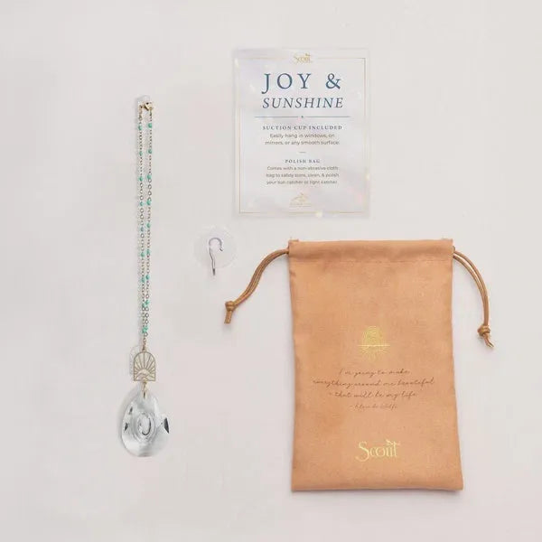 Pocket suncatcher featuring a clear teardrop glass design with gold-toned accents and a delicate beaded chain for shop daisy