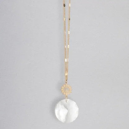 Gold chain necklace with small gear charm and round white translucent pendant pocket suncatcher for women’s boho chic clothing from shop daisy
