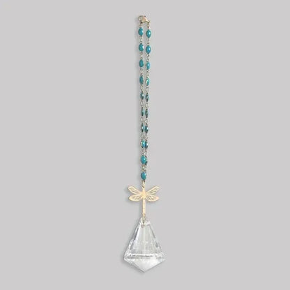 A delicate teal beaded pocket suncatcher with a gold dragonfly pendant and clear crystal teardrop from shop daisy